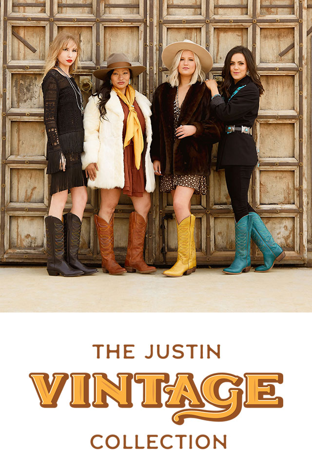 Four women standing in front of a gate wearing Justin Vintage boots. The Justin Vintage Collection.